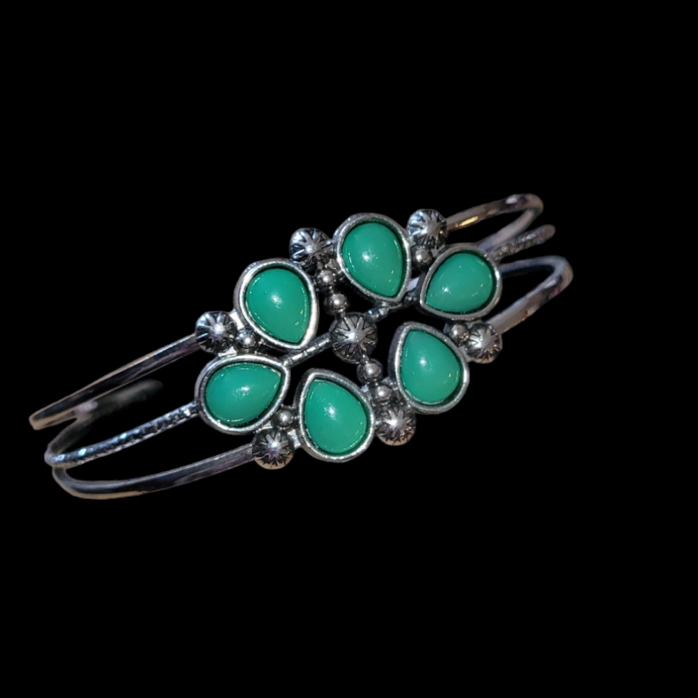Gorgeous silver open bangle bracelet with green teardrop accent stones